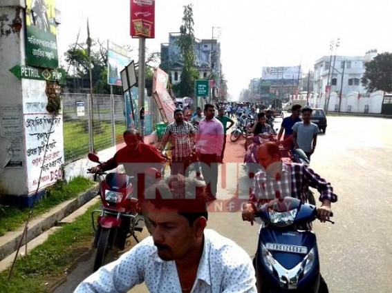 Certain relief for bikers amidst long queues Certain relief for bikers amidst long queues